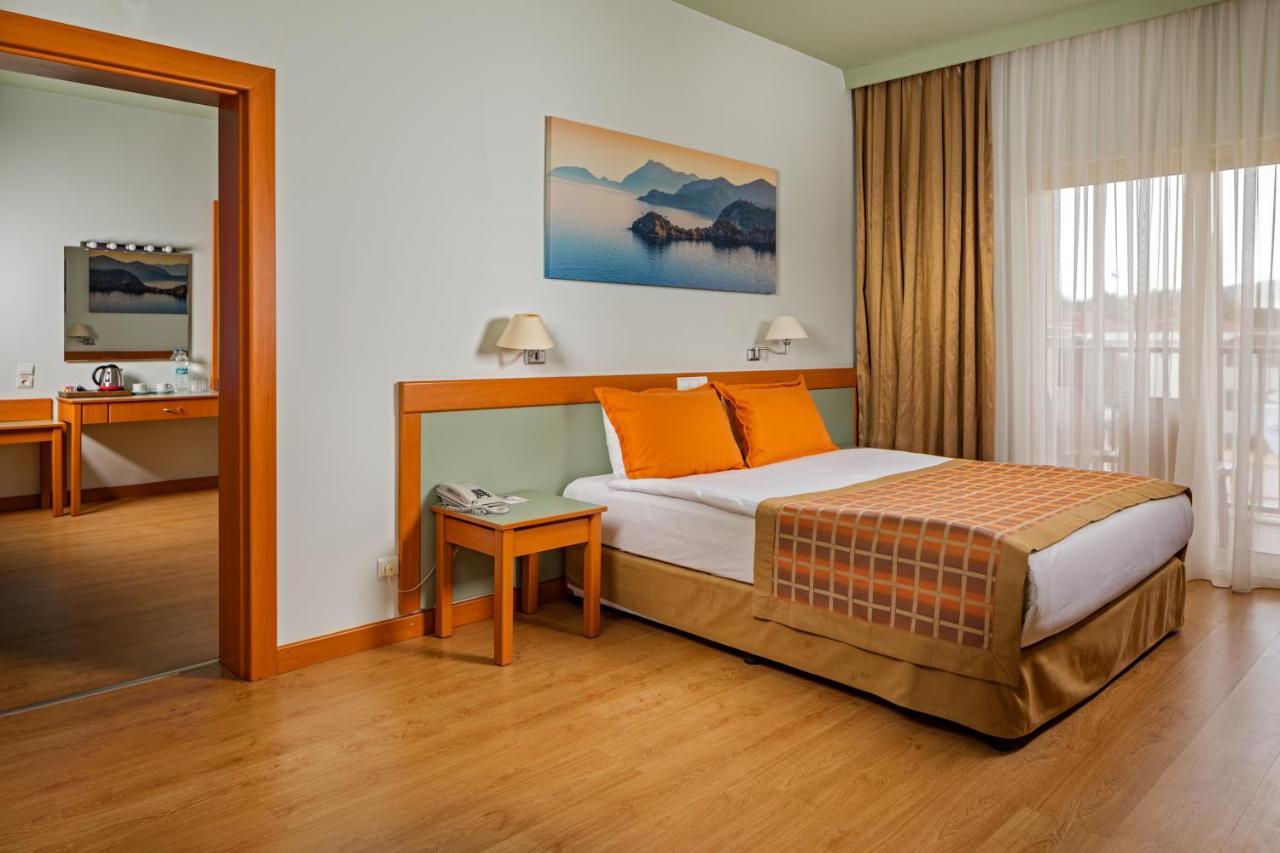 Aqi Hydros Club Kemer Exterior foto A bedroom in a hotel